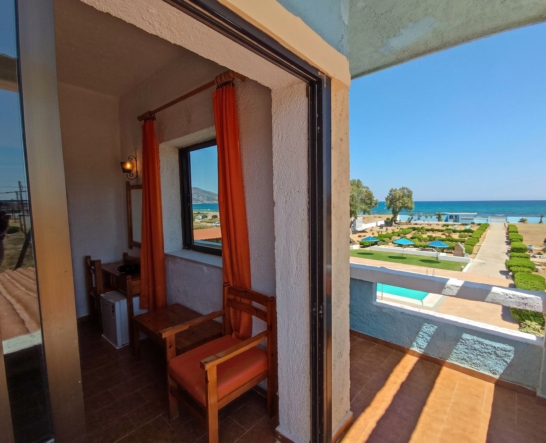 Triple Room balcony at Hotel Tsagarakis Beach, overlooking the garden, pool and Cretan sea